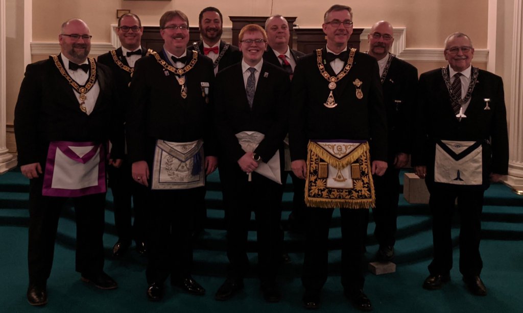 Bro. Alexander Newbury and members of Grand Lodge and District No. 2 at his Fellow Craft degree